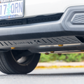 2025 Forester Front Skid Plate Installed on vehicle with gold dome washers