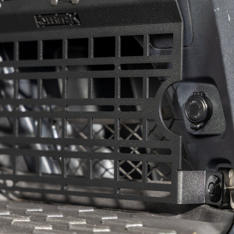 subaru outback molle panel installed in rear cargo storage area closeup of access to 12v accessory plug