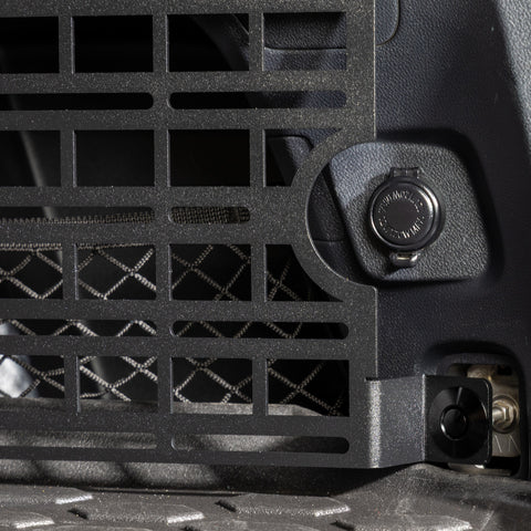 subaru outback molle panel installed in rear cargo storage area closeup of cutout for 12v accessory plug